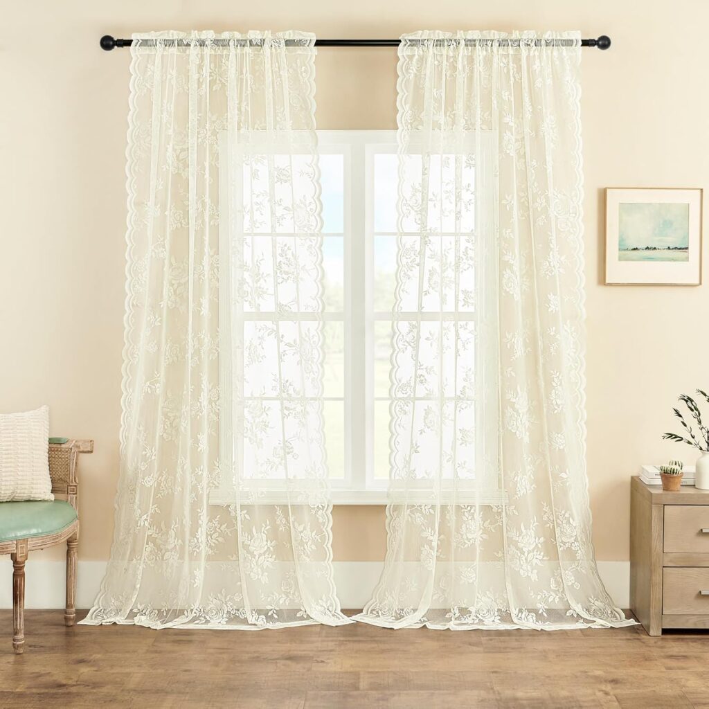 Ivory lace curtain panels with Victorian floral design, sheer and light-filtering, perfect for romantic French cottage or vintage-style bedrooms.