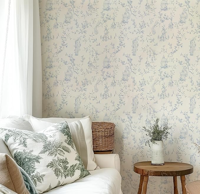 Blue and White French toile peel and stick wallpaper with bird and floral pattern.