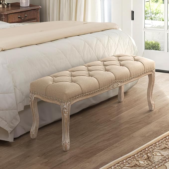 Elegant French-Style tufted linen bench with carved wooden legs and neutral wheat-toned upholstery, perfect for the foot of the bed or a romantic foyer.